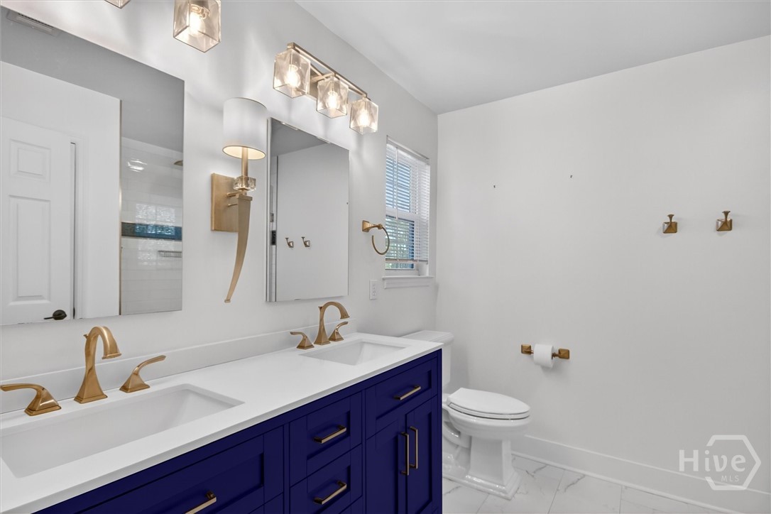 16 River Walk, Unit 16 Savannah, GA 31410 - Photo 10 of 37 Updated bath with custom finishes and thoughtful design