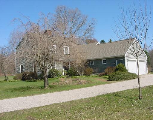 190 Redding Road Fairfield, CT 06824 - Photo 1 of 1 a view of a house next to a yard with big trees