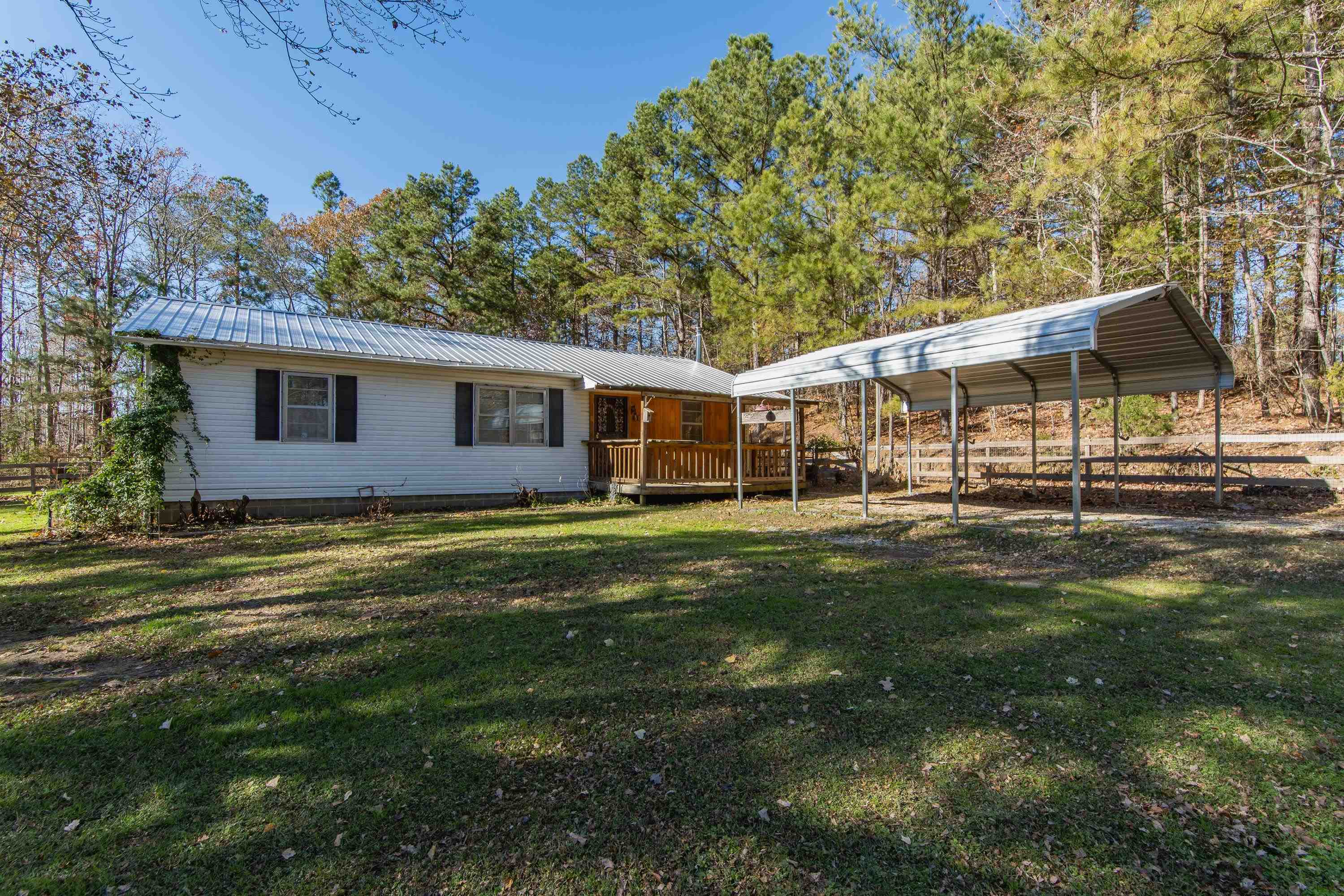3001 Hamilton Road Ashland, MS 38603 - Photo 1 of 39 Exterior space featuring a front yard, a deck, and a carport