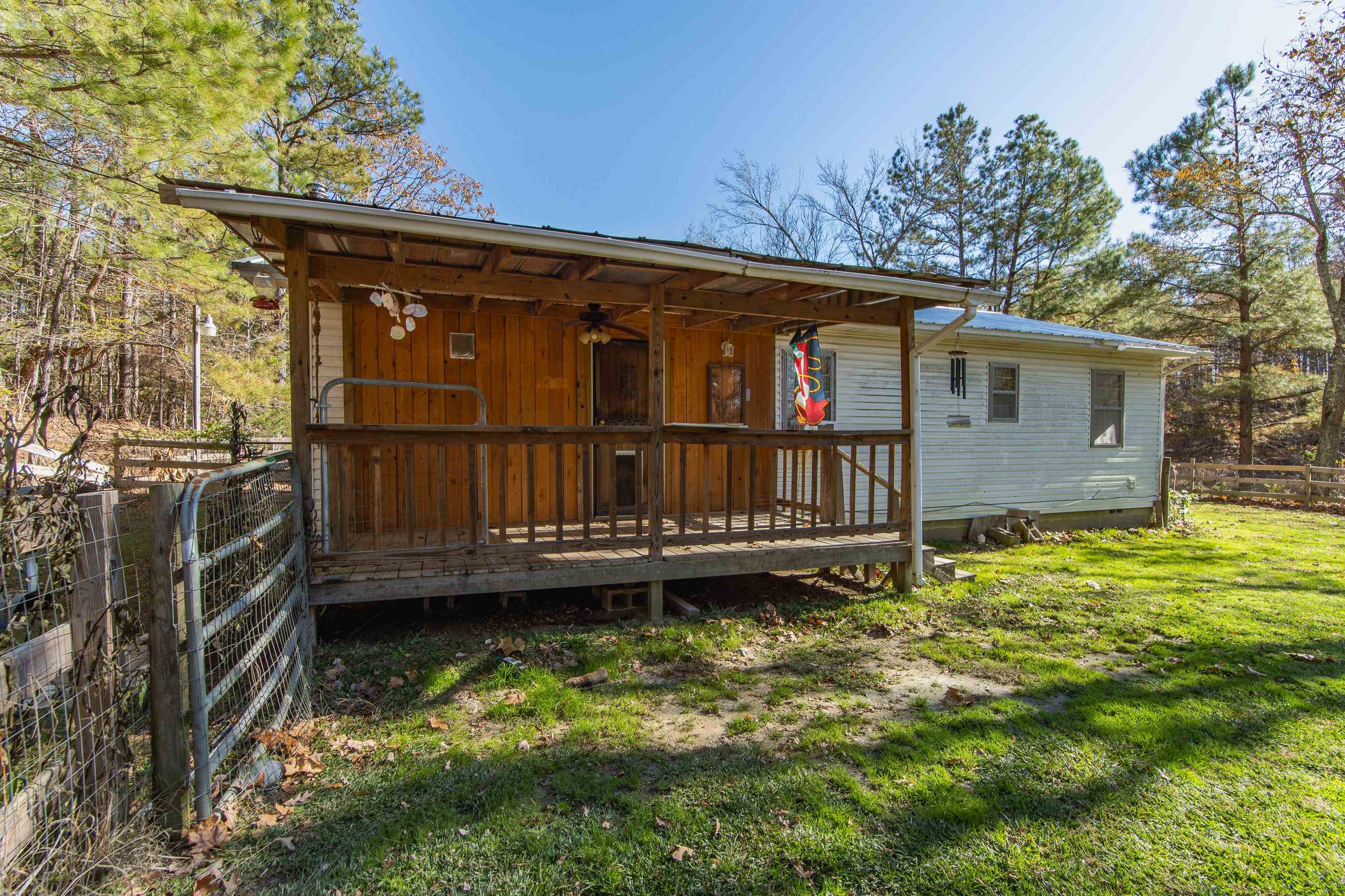 3001 Hamilton Road Ashland, MS 38603 - Photo 25 of 39 View of front facade featuring a wooden deck and a front lawn