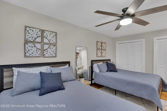 a bedroom with a large bed and furniture