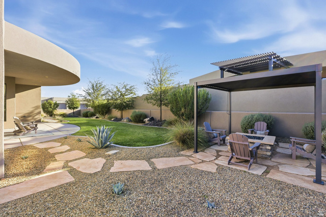 2197 Reserve Circle St. George, UT 84770 - Photo 53 of 57 Fenced backyard featuring a patio, a fire pit, and a pergola