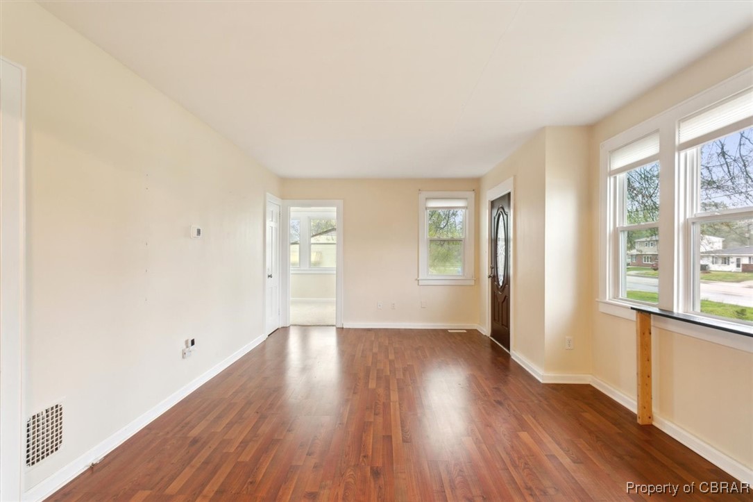 345 Fox Hill Road Hampton, VA 23669 - Photo 8 of 46 Empty room with dark wood-type flooring, visible vents, and baseboards