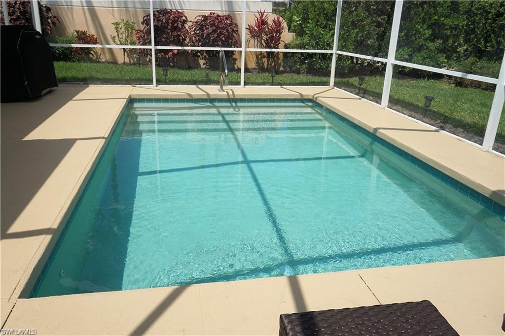 a view of a swimming pool with a garden