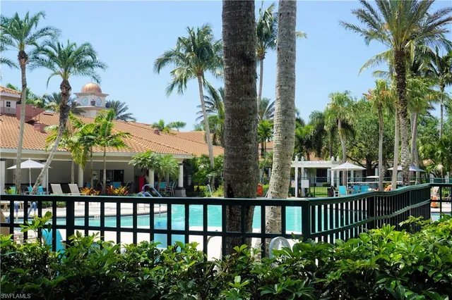 a view of a small yard and swimming pool