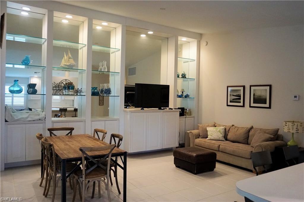 4194 St George Lane Naples, FL 34119 - Photo 6 of 29 a living room with furniture and a flat screen tv