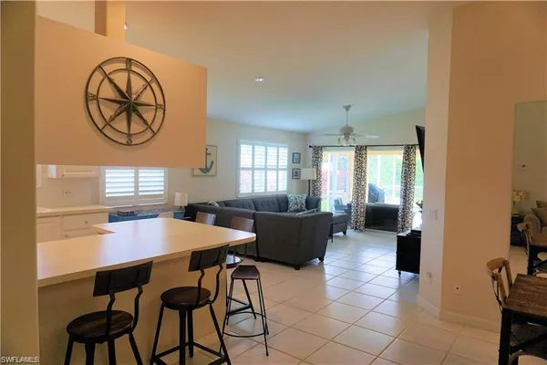 a view of a dining room with furniture and a window