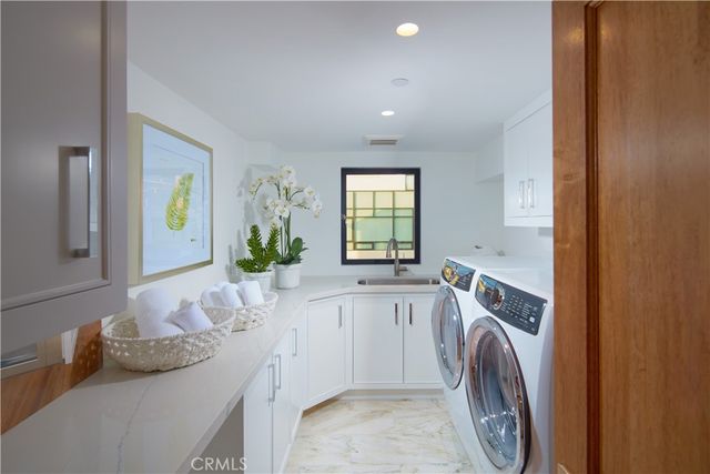 a living room with a wooden floor and a table