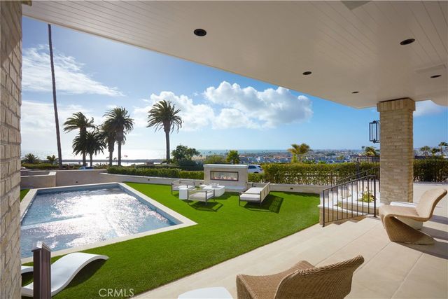 a view of swimming pool with chairs