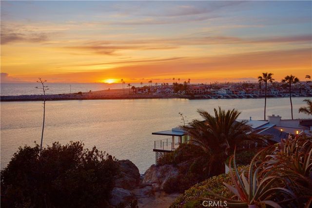 a front view of a house with a street