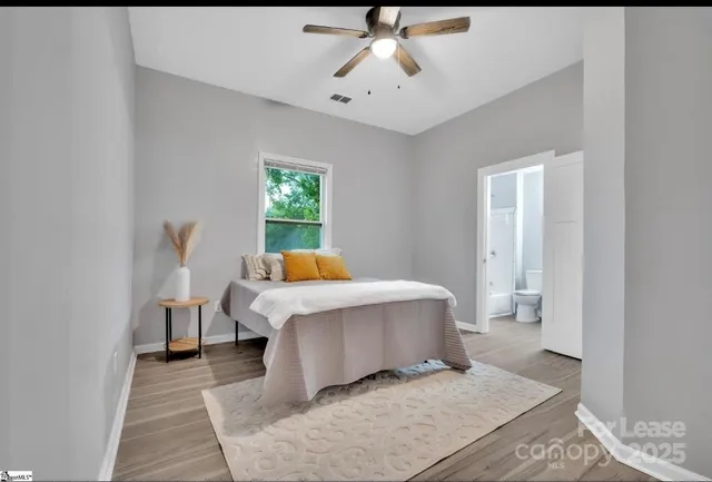 a living room with a couch and chandelier