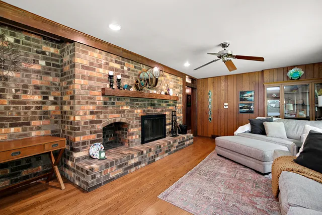a living room with furniture and a fireplace