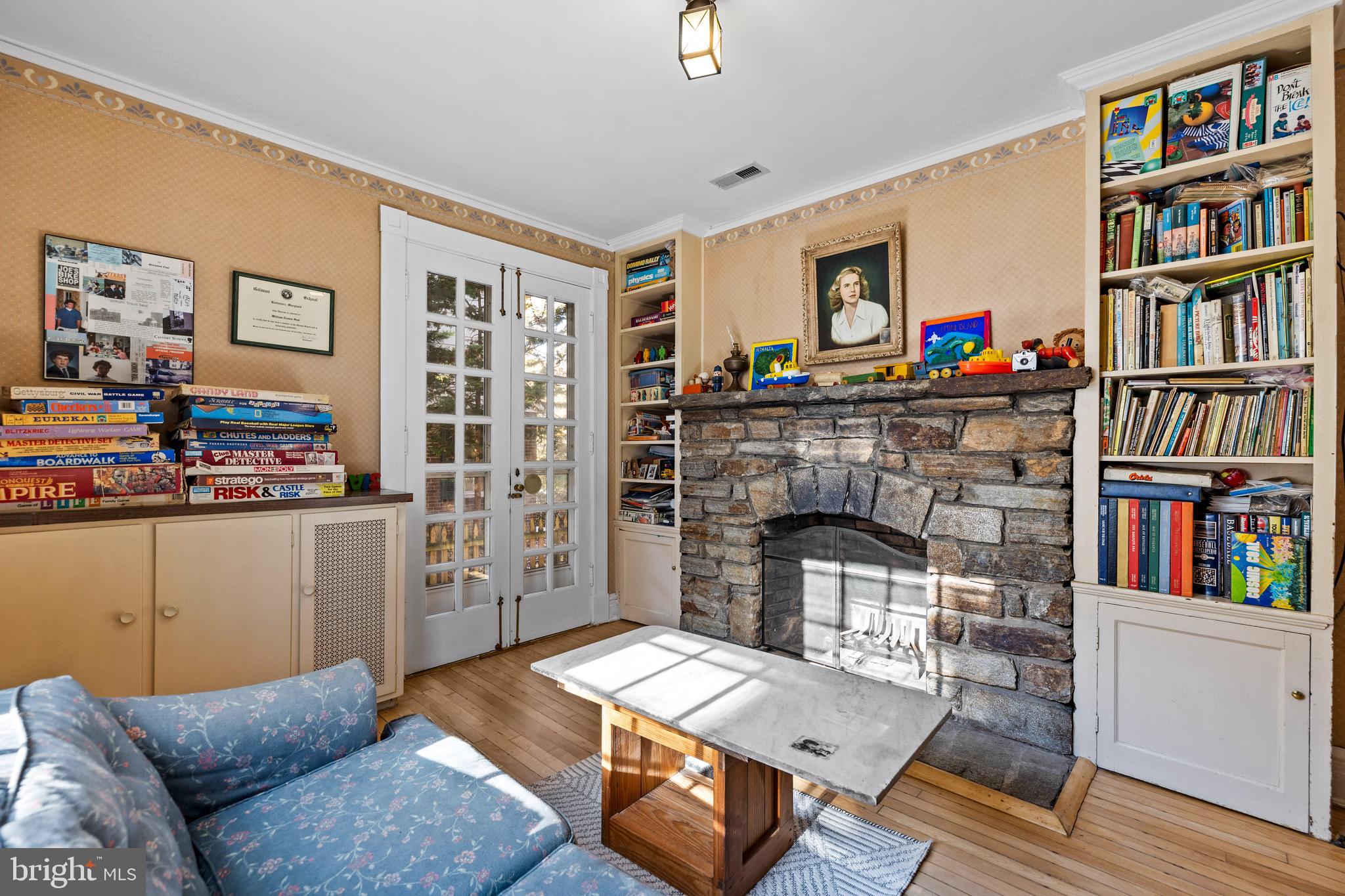 327 Broxton Road Baltimore, MD 21212 - Photo 19 of 47 The den also has a stone fireplace.