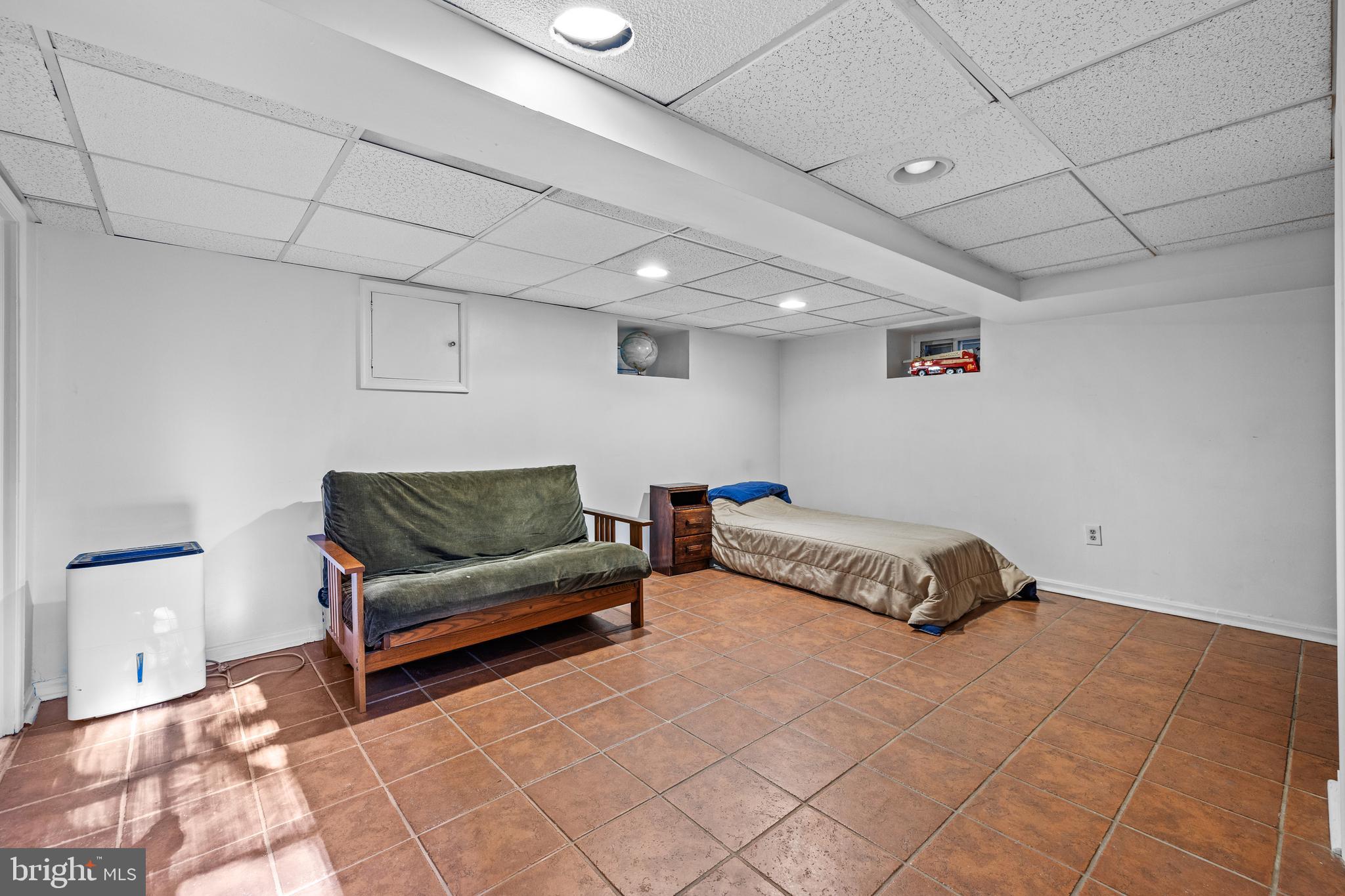 327 Broxton Road Baltimore, MD 21212 - Photo 35 of 47 Lower level finished area with ceramic tile.