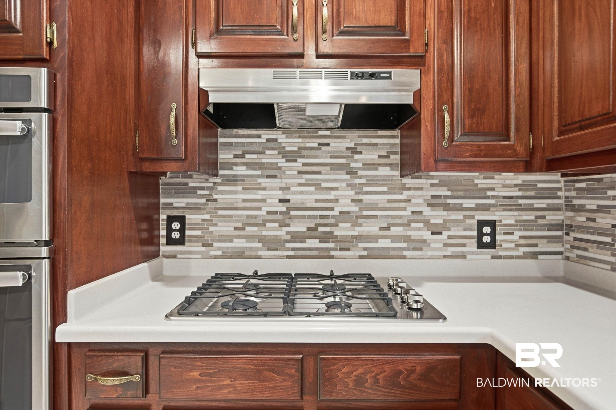 31515 Rhett Drive Spanish Fort, AL 36527 - Photo 18 of 100 This beautiful kitchen has plenty of prep space, corian countertops, a gas cooktop and stainless steel appliances. (Fridge and DW are brand new). The prep space measures 12' x 10' 6" and the eating area has a bay window and measures 13' 6" x 11' 8".