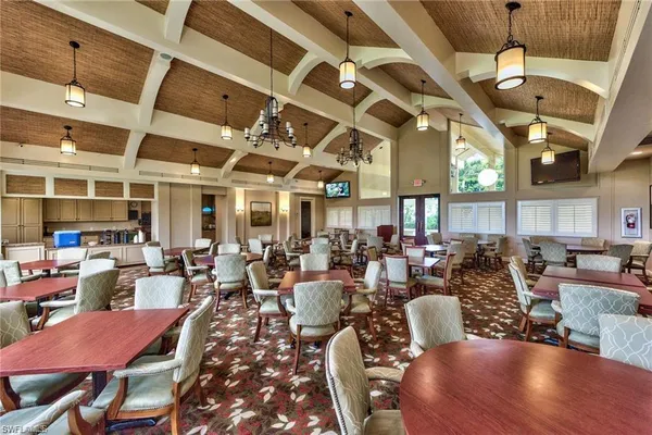 a large room with lots of furniture and view of dining room