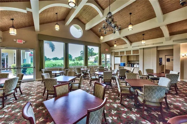 a view of a dining room with furniture wooden floor and chandelier