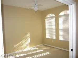 a view of an empty room and a window