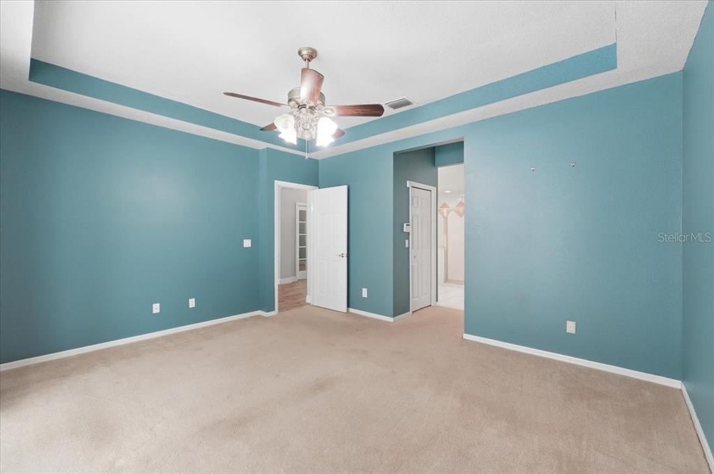 2214 Longmore Circle Valrico, FL 33596 - Photo 26 of 61 a view of an empty room with a chandelier fan