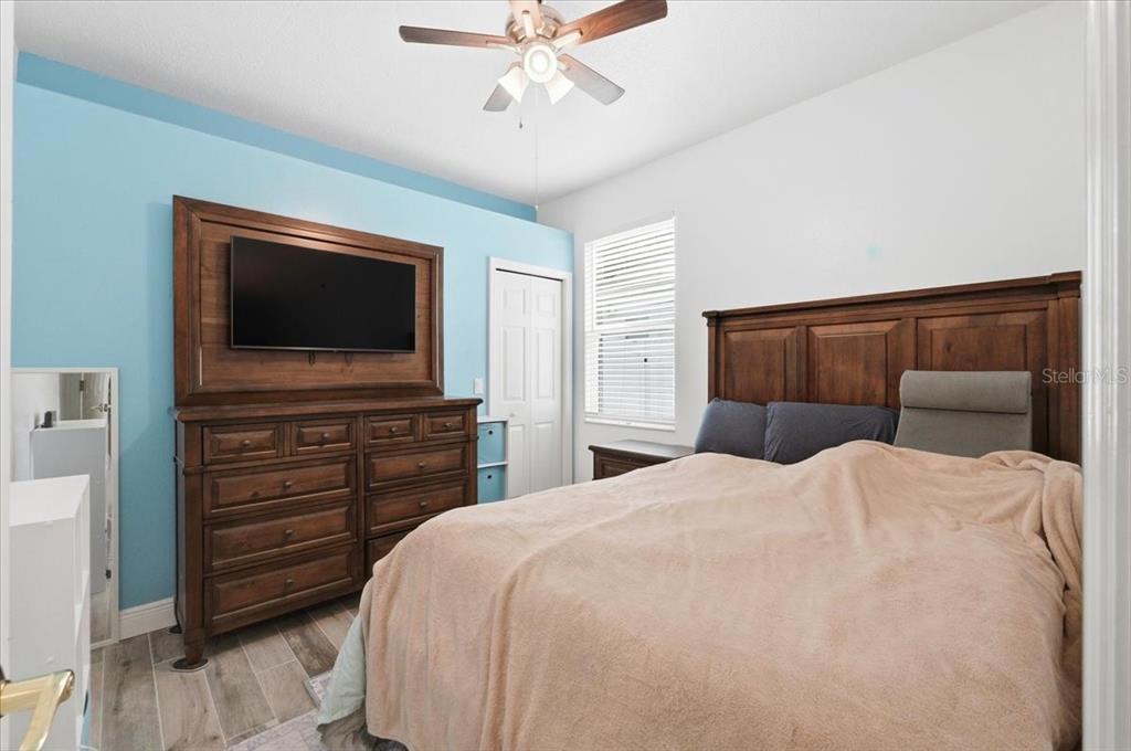 2214 Longmore Circle Valrico, FL 33596 - Photo 37 of 61 a bedroom with a bed and a flat screen tv