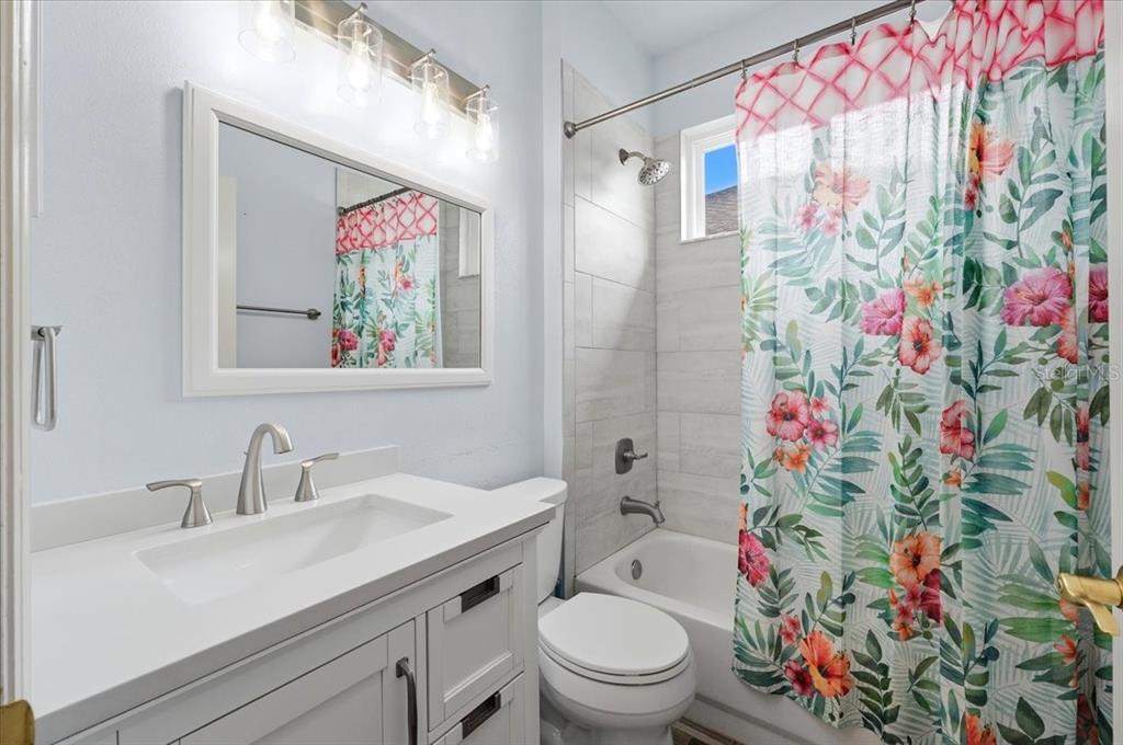 2214 Longmore Circle Valrico, FL 33596 - Photo 38 of 61 a bathroom with a sink mirror vanity and toilet