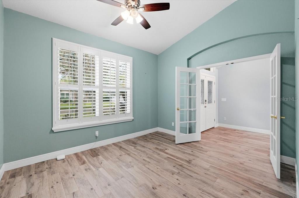 2214 Longmore Circle Valrico, FL 33596 - Photo 41 of 61 a view of an empty room with a window and wooden floor