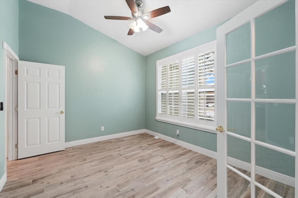 2214 Longmore Circle Valrico, FL 33596 - Photo 42 of 61 a view of an empty room with a window and wooden floor