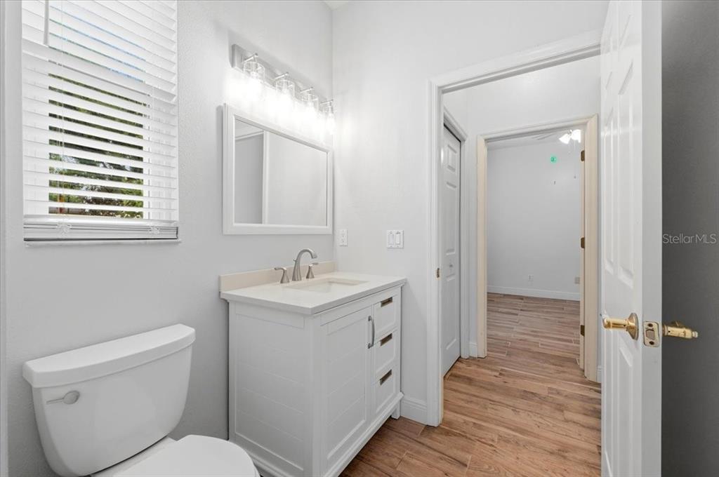2214 Longmore Circle Valrico, FL 33596 - Photo 43 of 61 a bathroom with a toilet sink and mirror