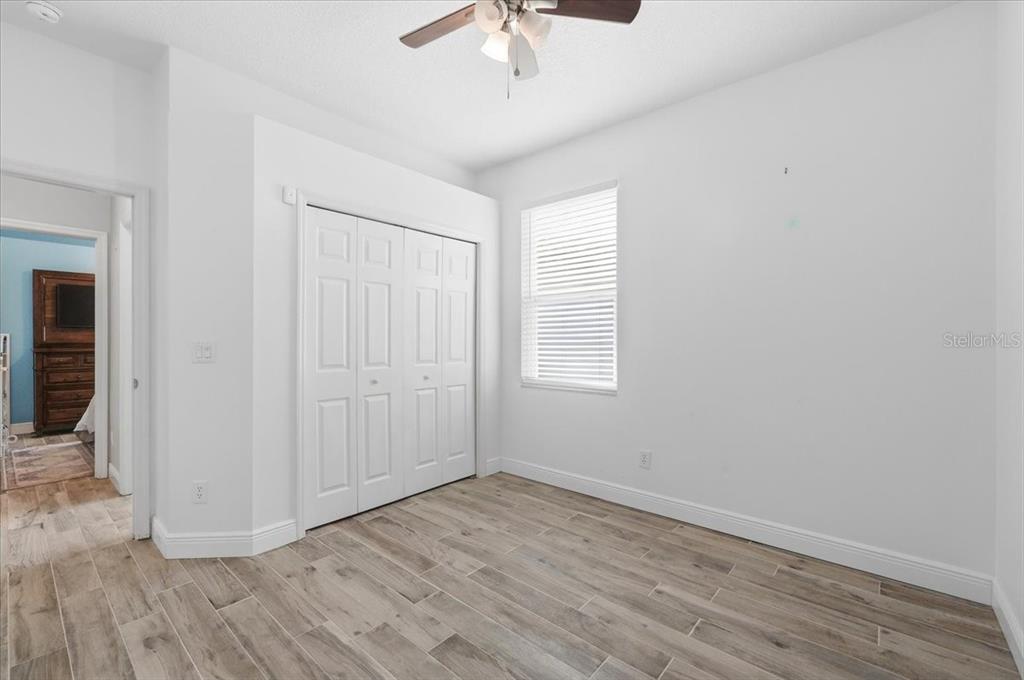 2214 Longmore Circle Valrico, FL 33596 - Photo 44 of 61 wooden floor in an empty room with a window
