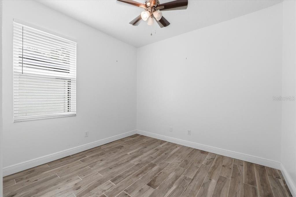 2214 Longmore Circle Valrico, FL 33596 - Photo 45 of 61 wooden floor in an empty room with a window