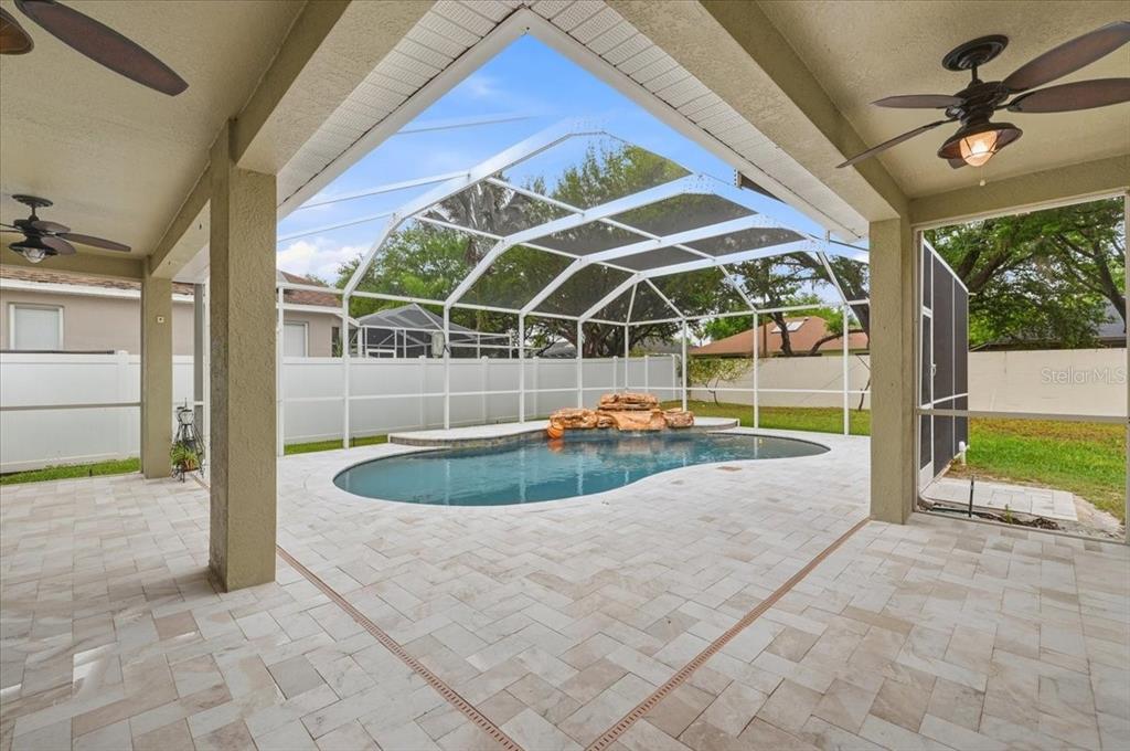 2214 Longmore Circle Valrico, FL 33596 - Photo 48 of 61 a view of a swimming pool with a porch