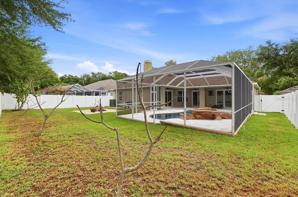 2214 Longmore Circle Valrico, FL 33596 - Photo 57 of 61 a view of a house with swimming pool and a yard