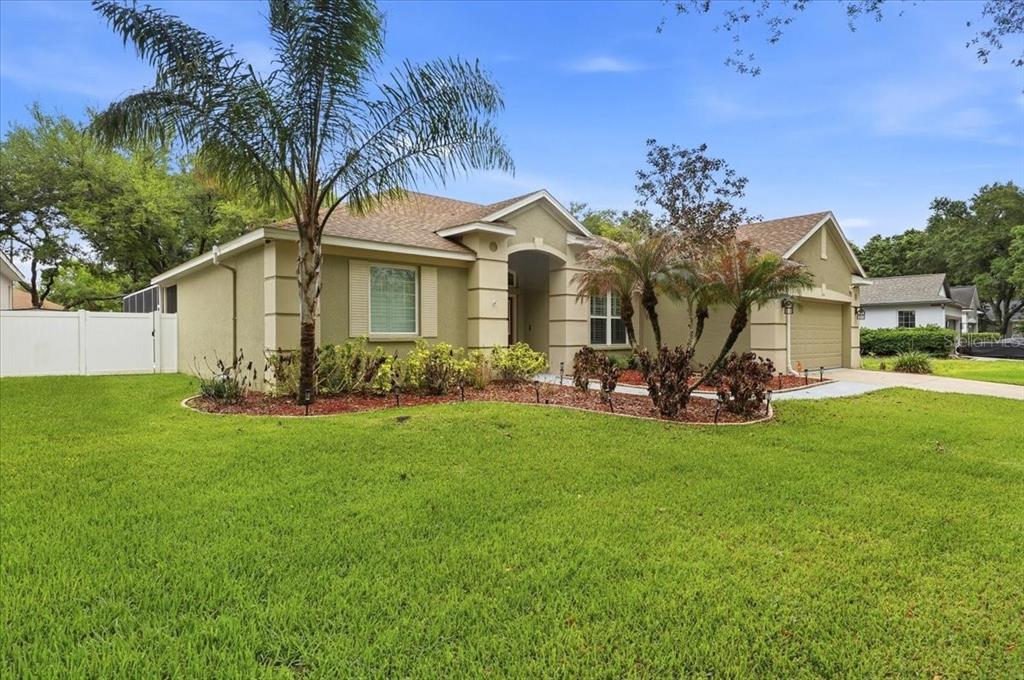 2214 Longmore Circle Valrico, FL 33596 - Photo 59 of 61 a front view of house with yard and green space