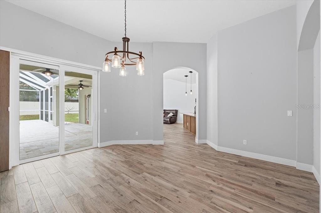2214 Longmore Circle Valrico, FL 33596 - Photo 9 of 61 a view of a room with wooden floor and window