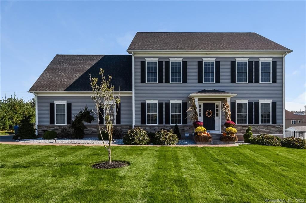 34 Blue Spruce Road South Windsor, CT 06074 - Photo 1 of 1 a front view of a house with garden