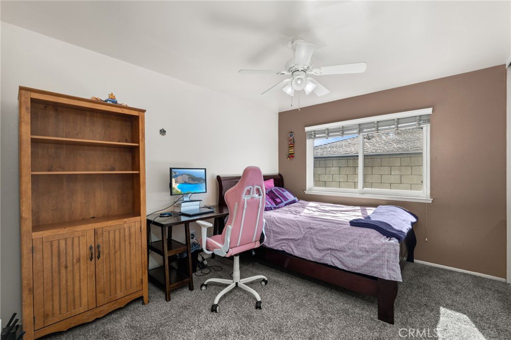 7221 Ramona Avenue Rancho Cucamonga, CA 91701 - Photo 19 of 30 a bedroom with a bed and a window