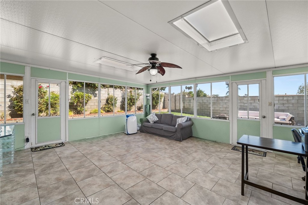 7221 Ramona Avenue Rancho Cucamonga, CA 91701 - Photo 21 of 30 a living room with furniture and a large window