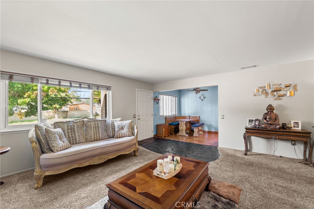7221 Ramona Avenue Rancho Cucamonga, CA 91701 - Photo 5 of 30 a living room with furniture and a large window