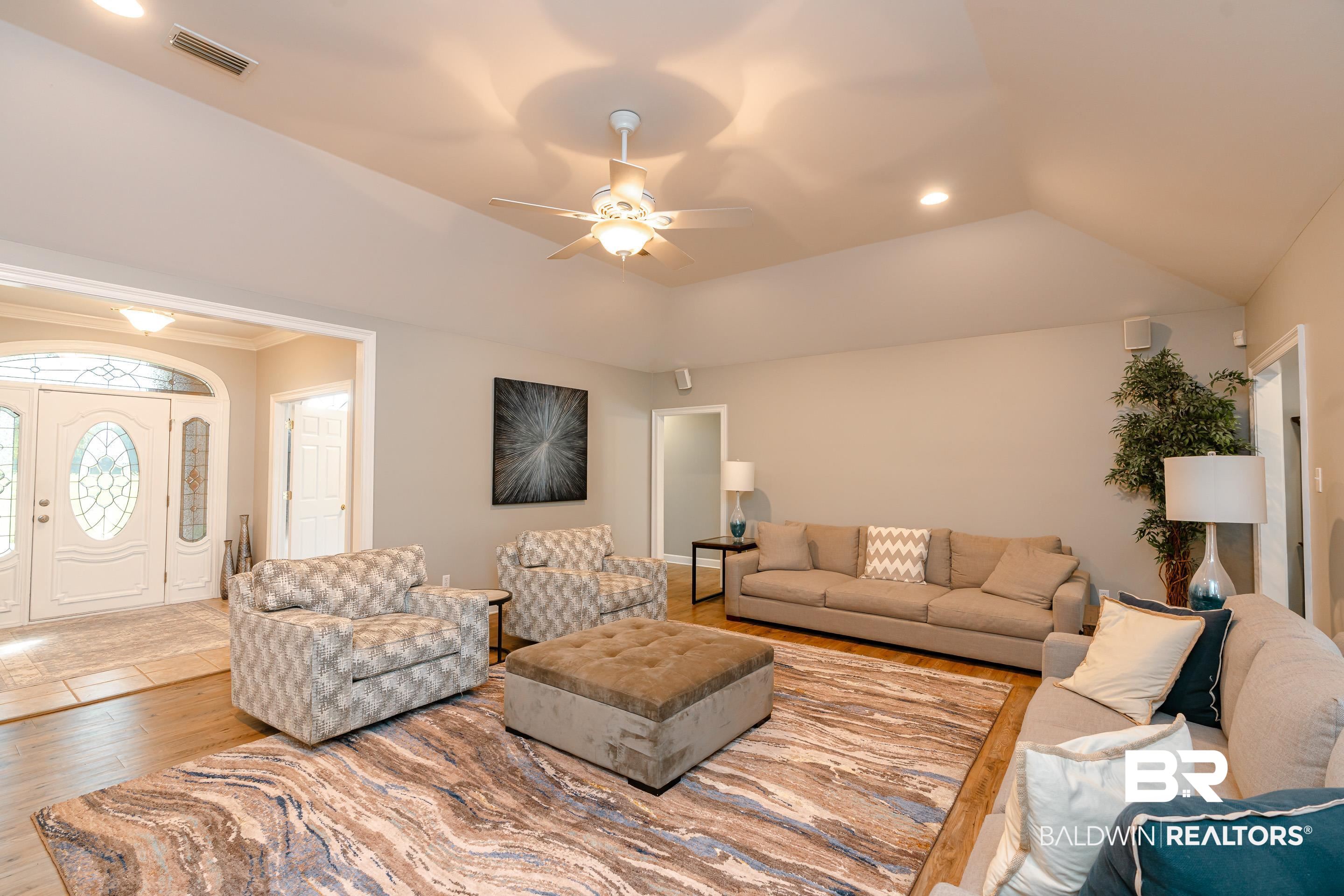 9477 Deerfield Drive Irvington, AL 36544 - Photo 6 of 58 Living room featuring ceiling fan and light wood-type flooring