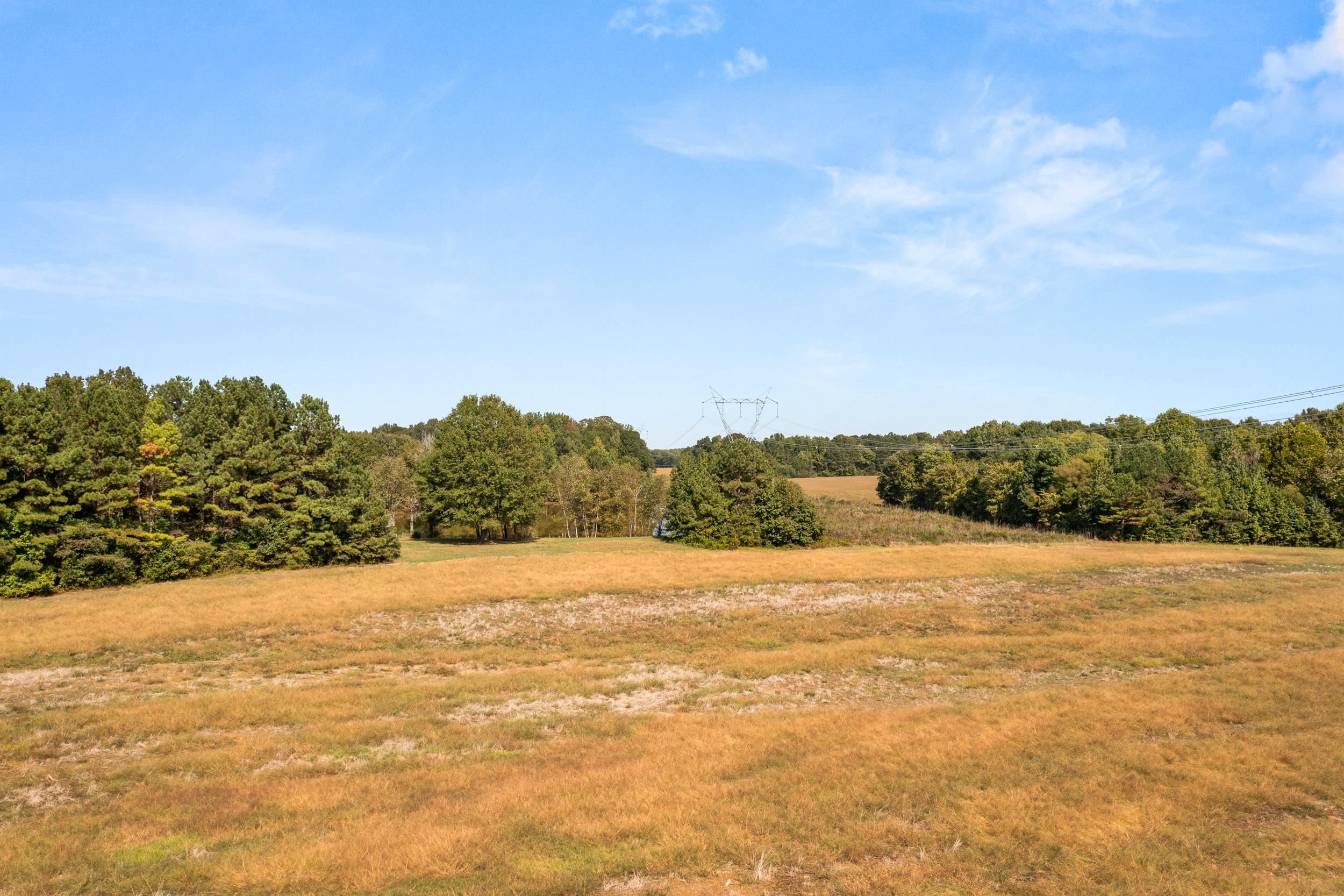 View of wooded area with a view of rural / pastoral area