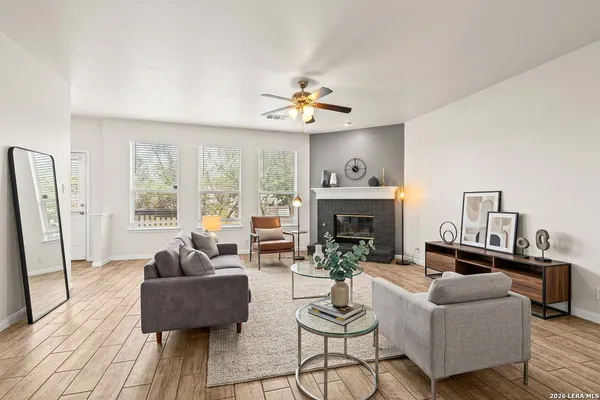 a living room with furniture and a fireplace