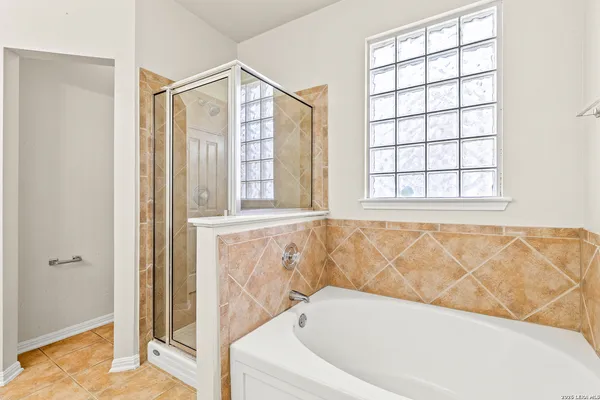 a bathroom with a bathtub and window