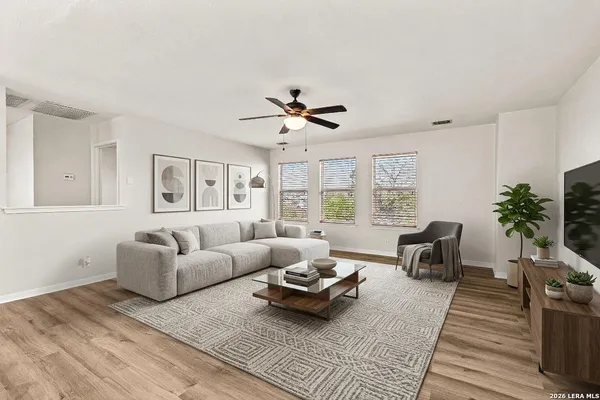 a living room with furniture and a large window