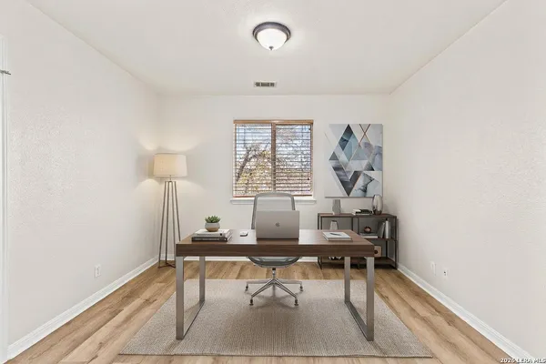 a room with furniture and a window