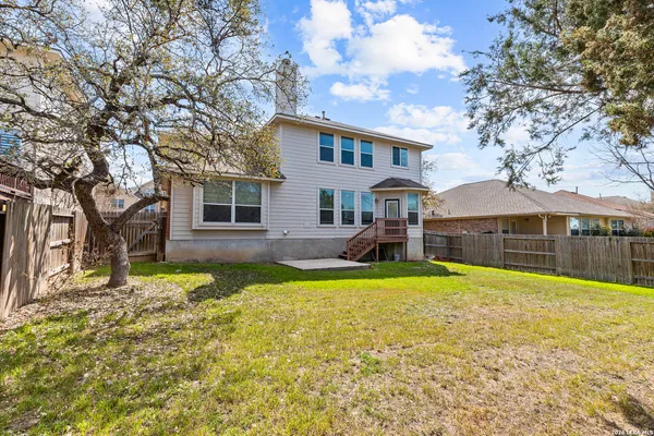 a view of yard with swimming pool and trees