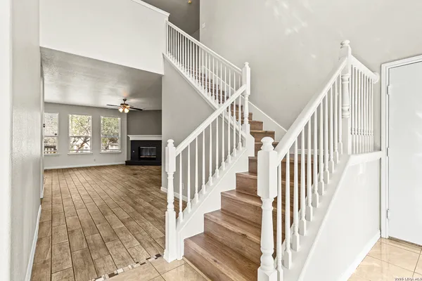 a view of entryway and hall with wooden floor