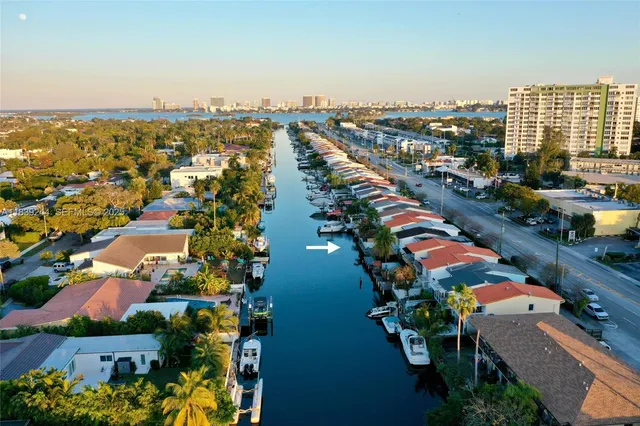 an aerial view of residential building and lake