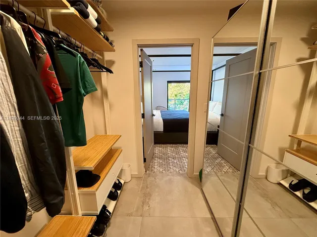 a balcony with table and chairs