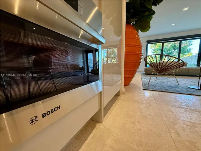a view of living room with furniture and a flat screen tv
