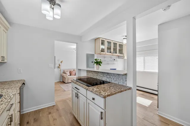 a kitchen with a sink stove and refrigerator